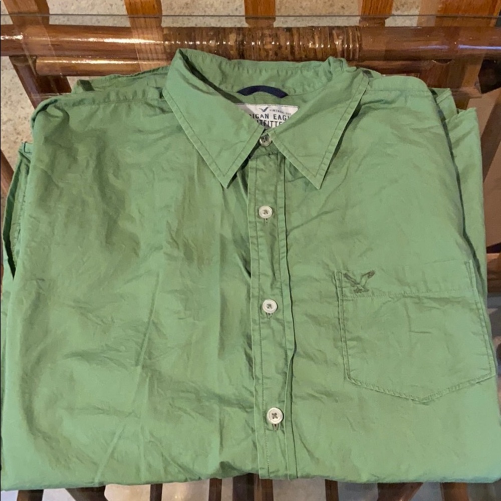 Olive green, buttoned up collard shirt with pocket